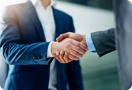 two men shaking hands in a business meeting